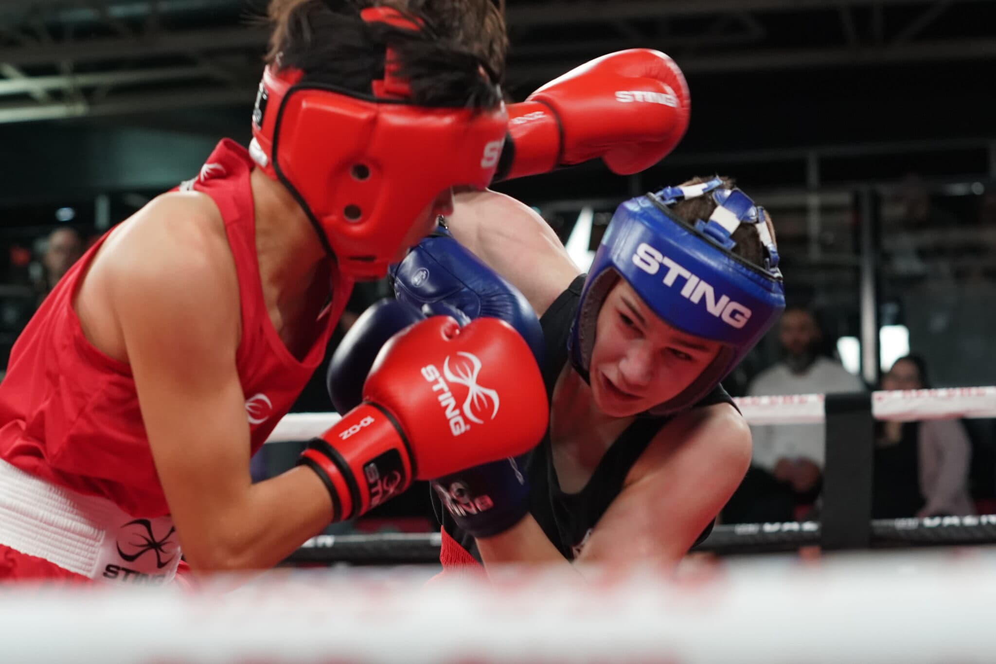 Two boxers sparring in the ring